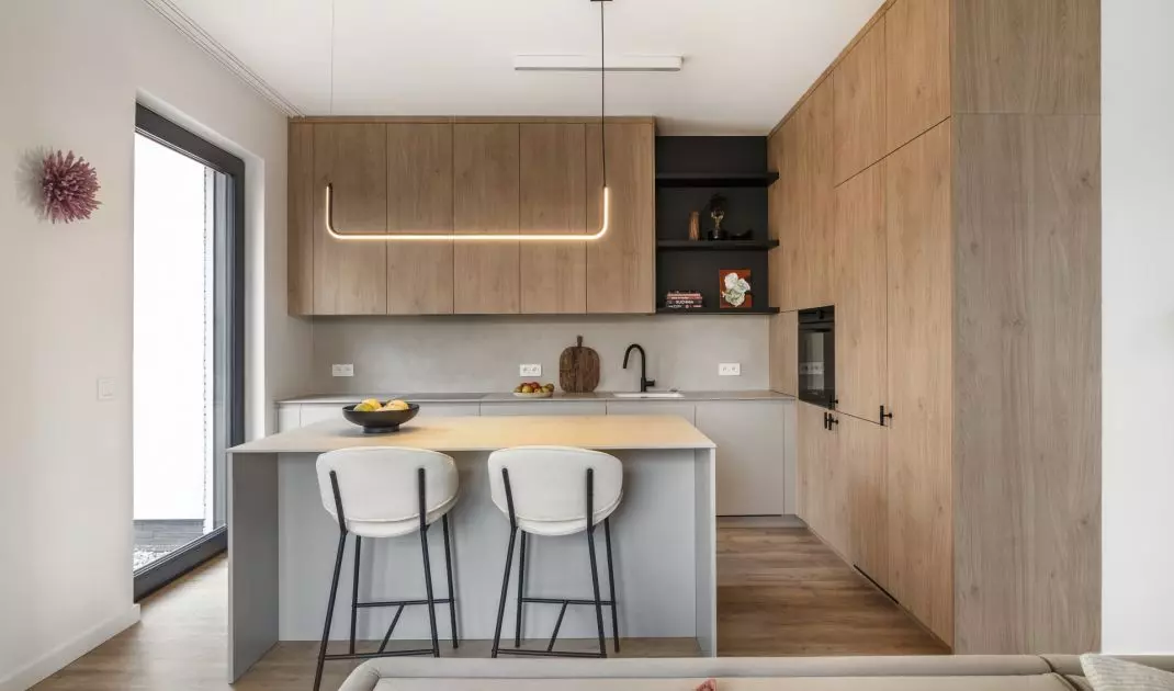 The kitchen cabinet has two different front finishes
