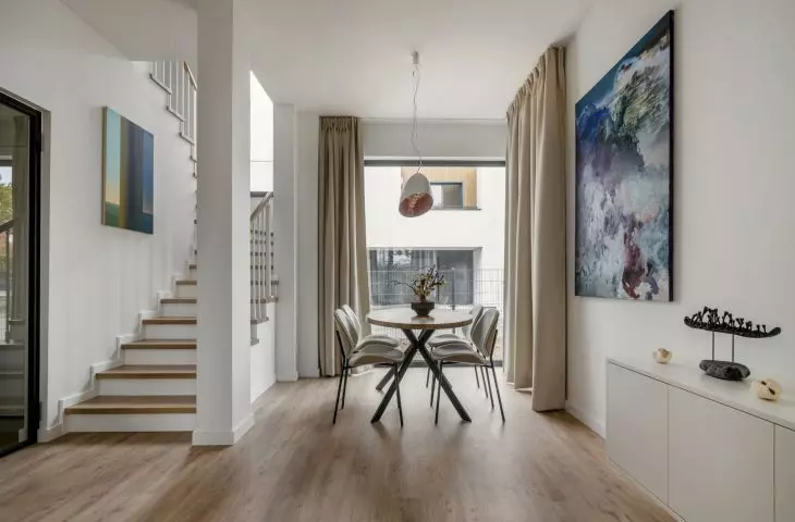 White walls are decorated with intriguing paintings