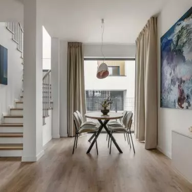 White walls are decorated with intriguing paintings
