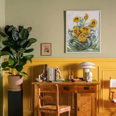 Wainscoting in a sunny shade will enliven the interior