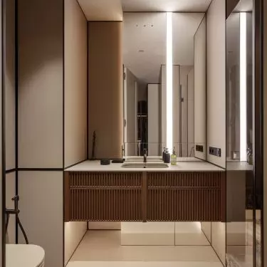 The washbasin was placed on a wooden cabinet with fluting