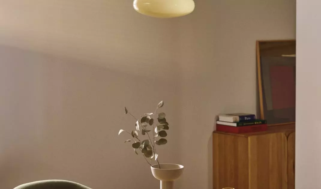 Lamp in butter yellow shade will add subtle charm to the interior