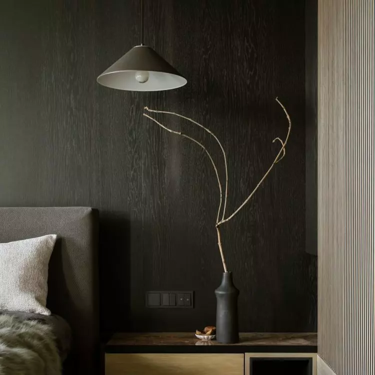 The dark lamp is practically invisible against the anthracite background