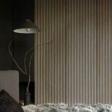 The corrugated panel was made of stained raw MDF