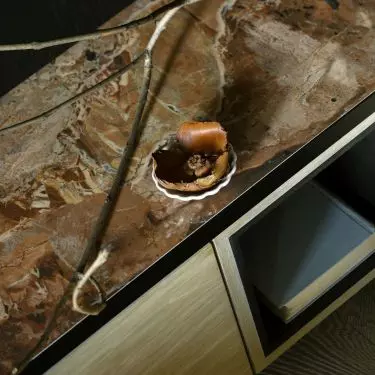 The bedside table was finished with a marble top
