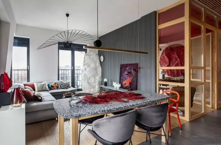 Red accents contrast beautifully with concrete