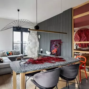 Red accents contrast beautifully with concrete