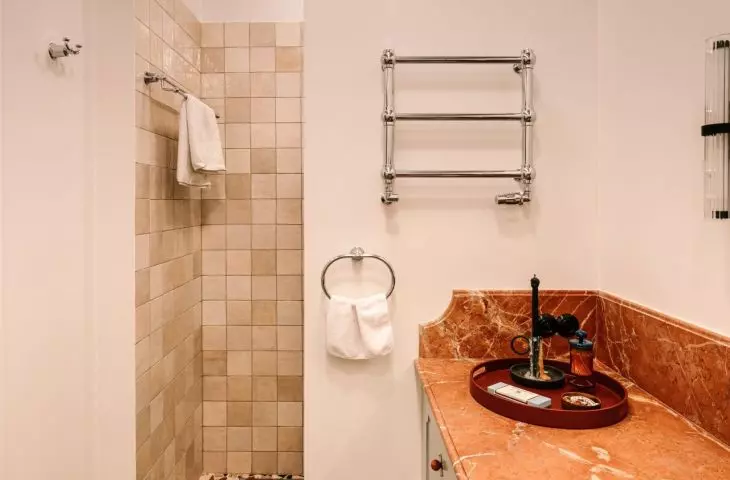 The marble top has a warm orange hue
