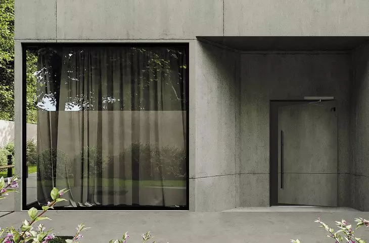 Dom z betonową elewacją, drzwi ukryte licowane z okładziną beton architektoniczny 