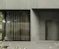 House with concrete facade, concealed doors faced with architectural concrete cladding 