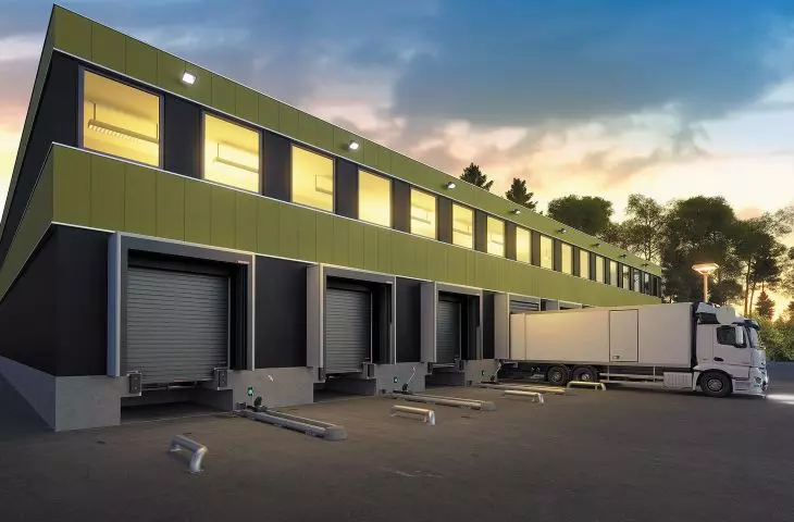 Loading dock: ramp, sectional gate, gate seal, restraints, guides and wheel locking system