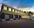 Loading dock: ramp, sectional gate, gate seal, restraints, guides and wheel locking system