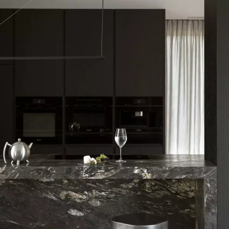The kitchen is kept in shades of black