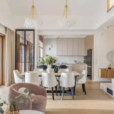 Lamps suspended over the table resemble clouds