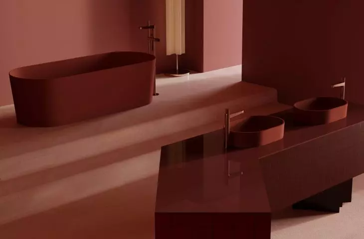 The juxtaposition of glossy and matte surfaces adds depth to a monochromatic arrangement