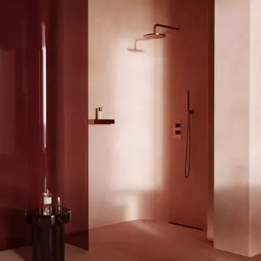 Walls in shades of warm terracotta blend seamlessly with the floor