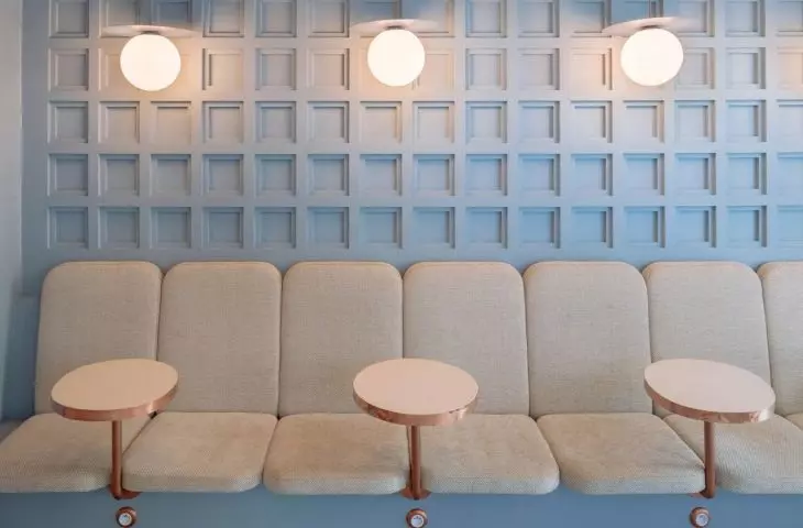 Elongated sofa with high backrest