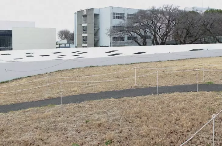 KAIT Plaza's white form is a contrast to the rather chaotic and heterogeneous buildings of the university campus