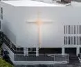 The facade of the Church of Joy in Bangkok symbolizes the boundary between the earthly and the divine, with the Unity Cross as its centerpiece