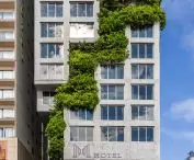 A hotel in Da Nang, Vietnam - the shorter western facade is distinguished by a sculptural structure into which greenery has been woven