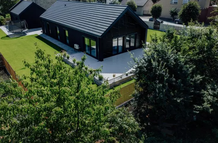 A timber frame house is a construction based on a wooden frame, popular for its speed of construction and lower cost