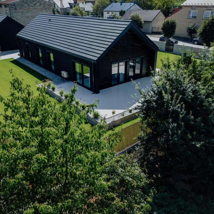A timber frame house is a construction based on a wooden frame, popular for its speed of construction and lower cost