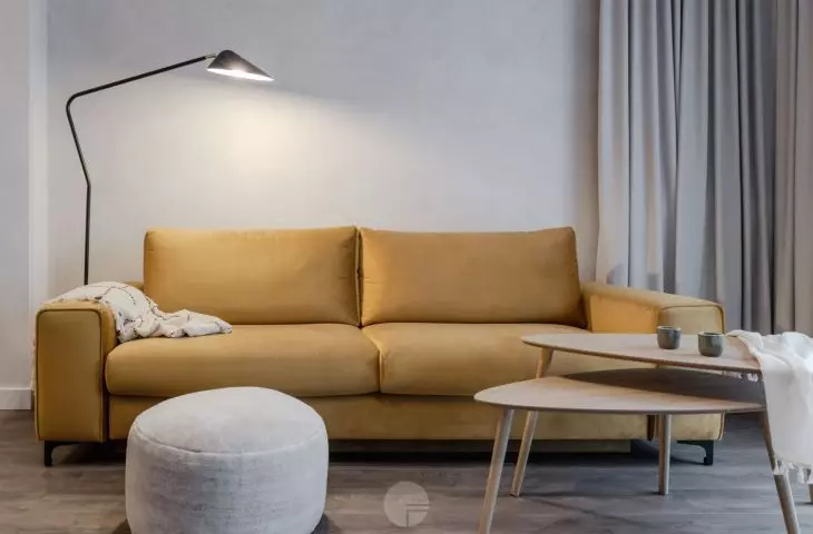 Mustard sofa makes a colorful accent in the living room