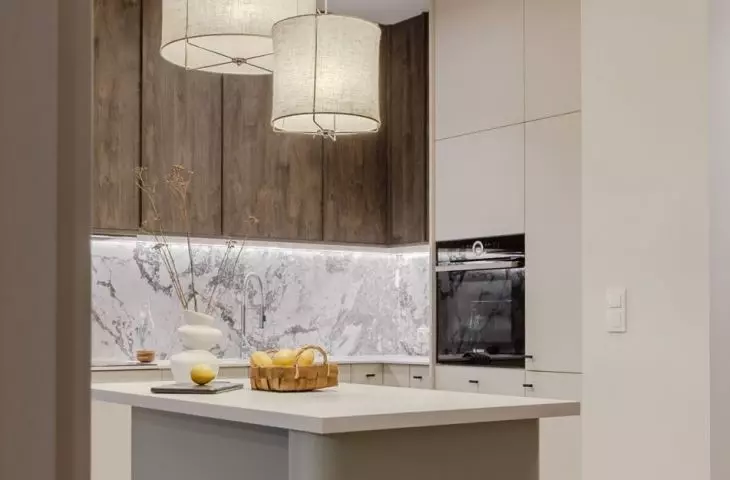 The kitchen island has fashionable rounded edges