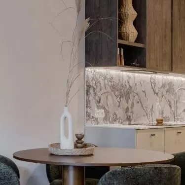The dining area is located right next to the kitchenette