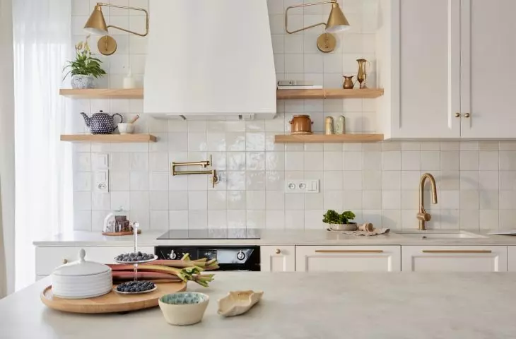 Kitchen island in Letnica apartment becomes the center of the house