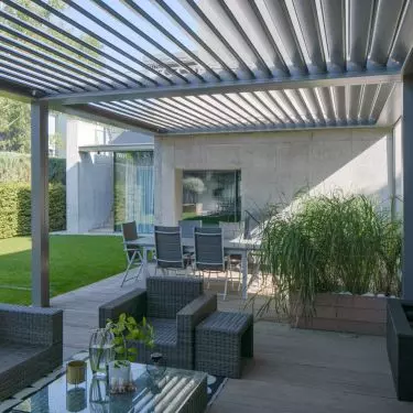 Garden furniture and accessories match the style of the house and its surroundings