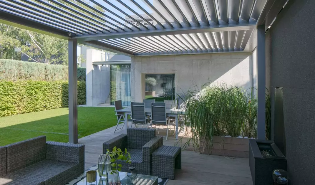 Garden furniture and accessories match the style of the house and its surroundings