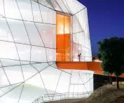 Plasencia conference center - an orange ramp leads inside the building 