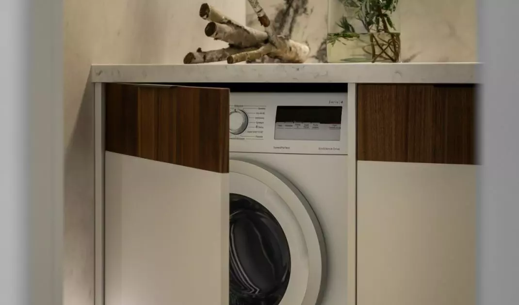 The enclosure hides the washing machine