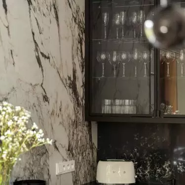 The kitchenette is dominated by a combination of black and white