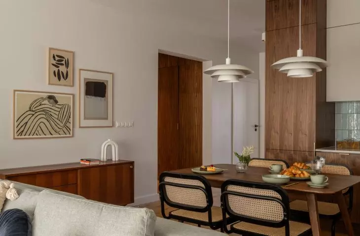 The living room is the heart of the apartment - open to the kitchen, with a separate dining area