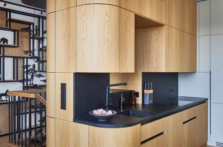 A view of a kitchen with a rounded shape 