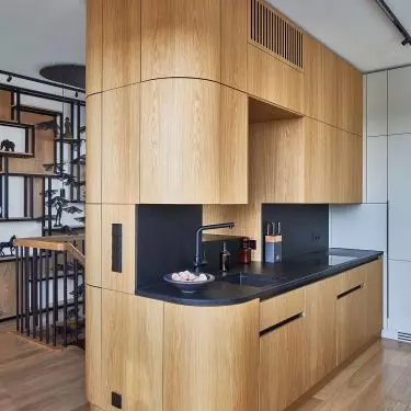 A view of a kitchen with a rounded shape