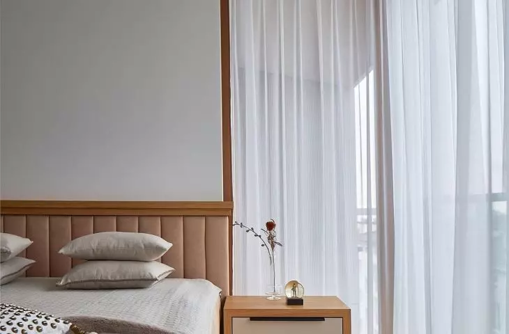 The master bedroom impresses with a large corner window that lets in plenty of natural light