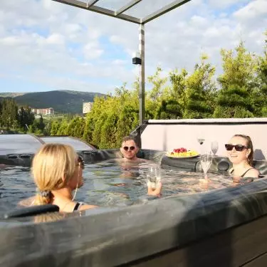 Installation of a hot tub requires a stable foundation, access to power and a drainage system