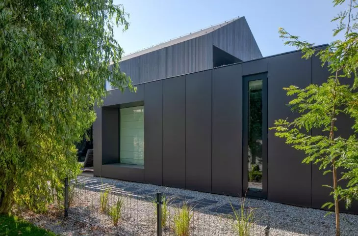 The building's surroundings emphasize the modern character of the project