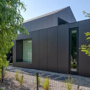 The building's surroundings emphasize the modern character of the project