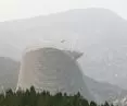 The Shaolin Flying Monk Theater, erected on Cypress Hill, draws on this heritage, offering space for spectacular shows