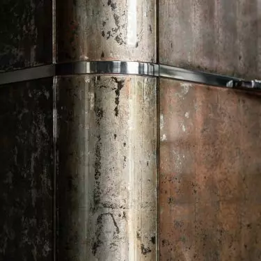 Finishing furniture with silver flakes is done entirely by hand