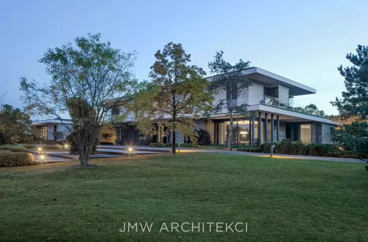 The facade has been divided into segments that differ in materials and texture