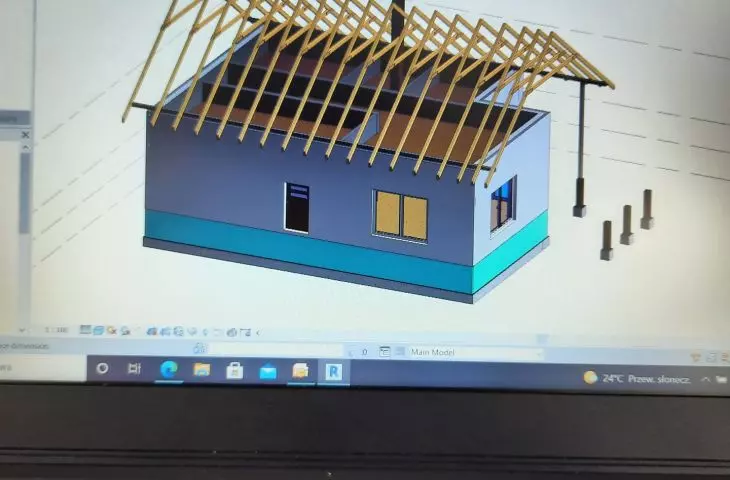 photo of the work at the laptop retraining with revit.