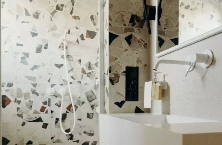 The small bathroom managed to accommodate a shower