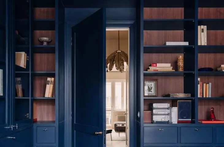 A home office with navy blue interior design