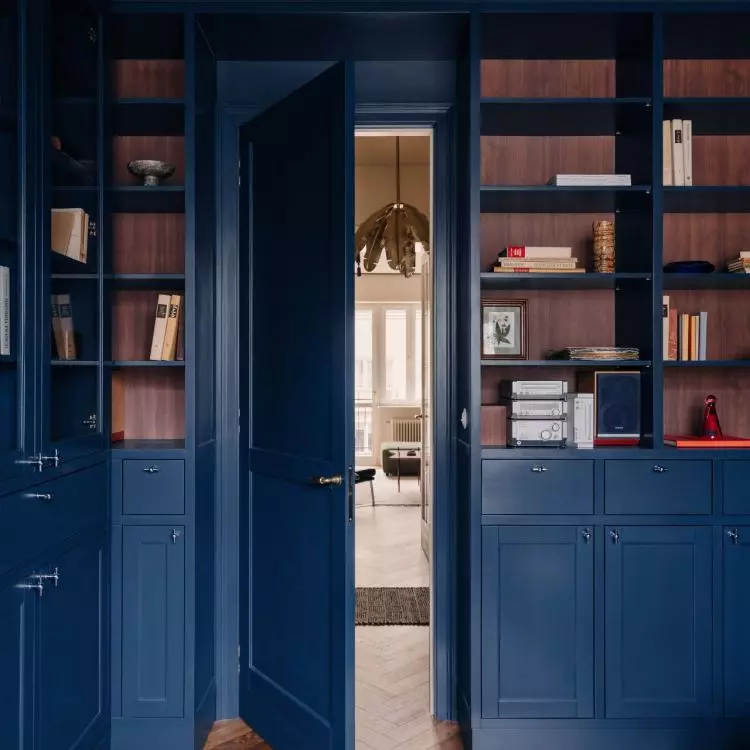 A home office with navy blue interior design
