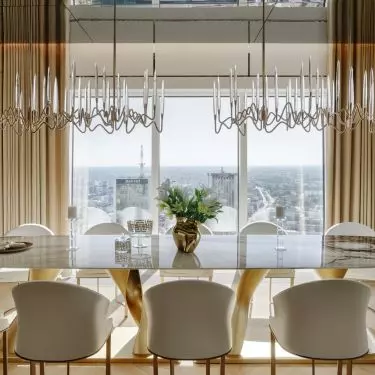 Tall floor-to-ceiling windows let in plenty of natural light while offering views of the Warsaw skyline